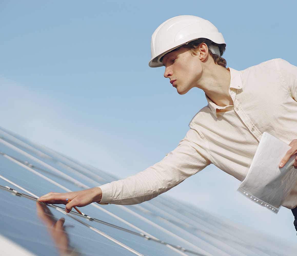 Person Checking Solar Panels